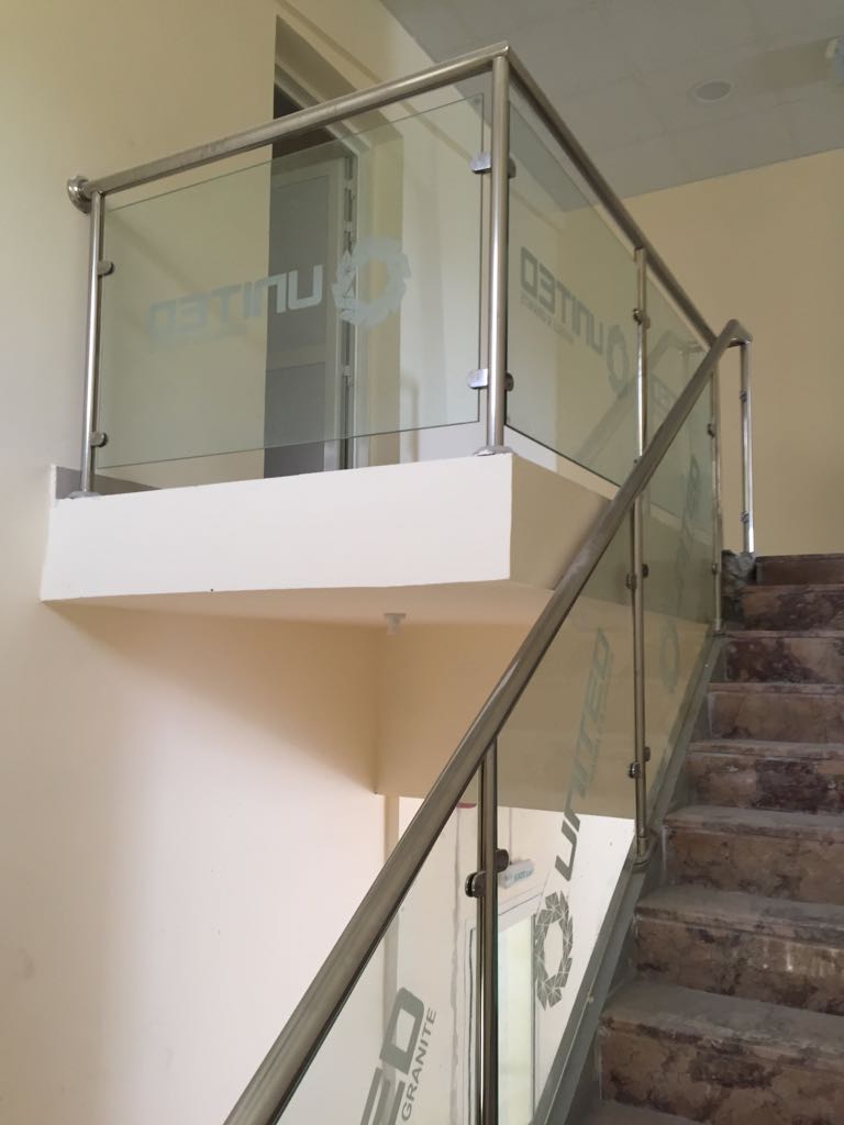 Toughened glass balustrade with stainless steel handrail